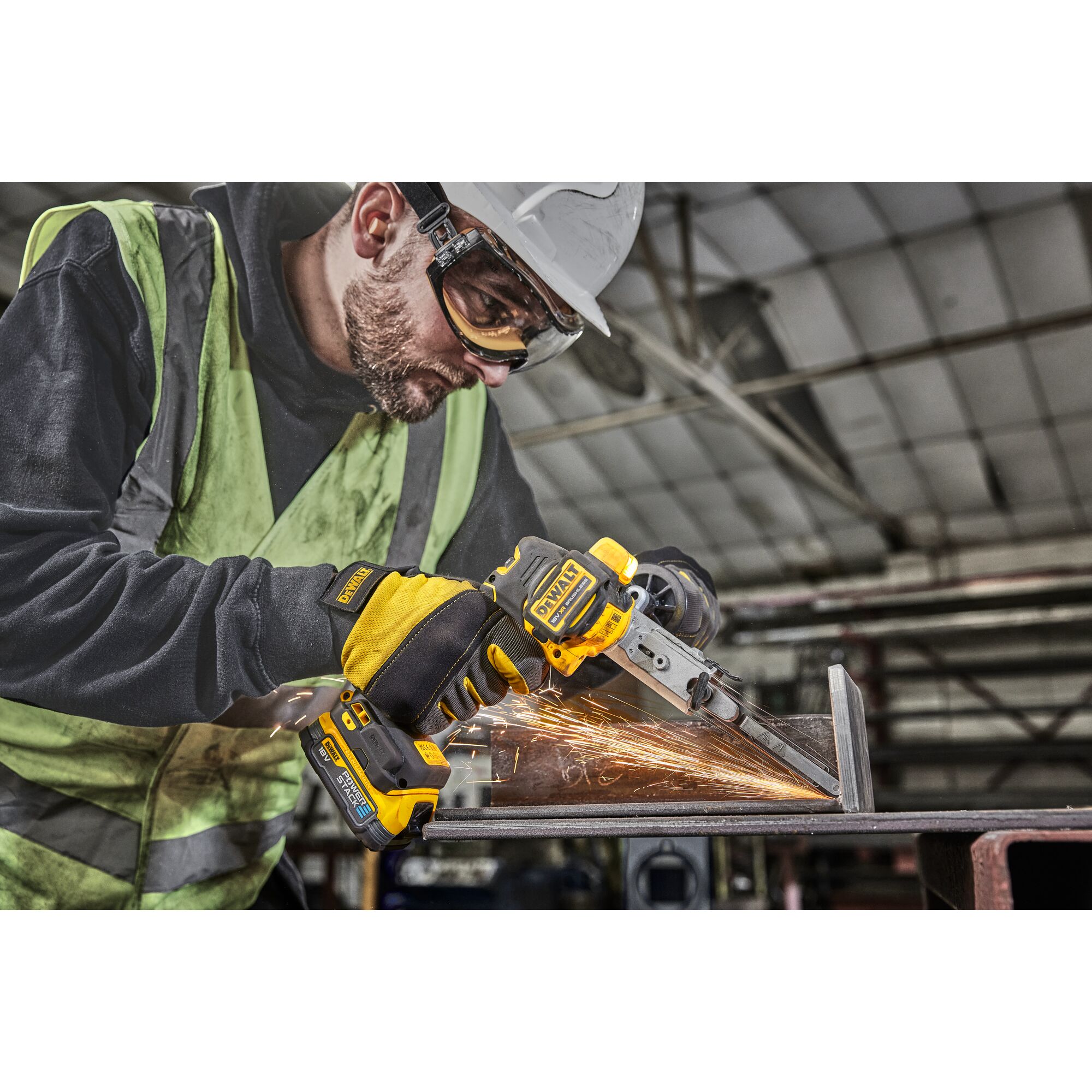 Worker in high vis  using 18V XR Band File to sand metal