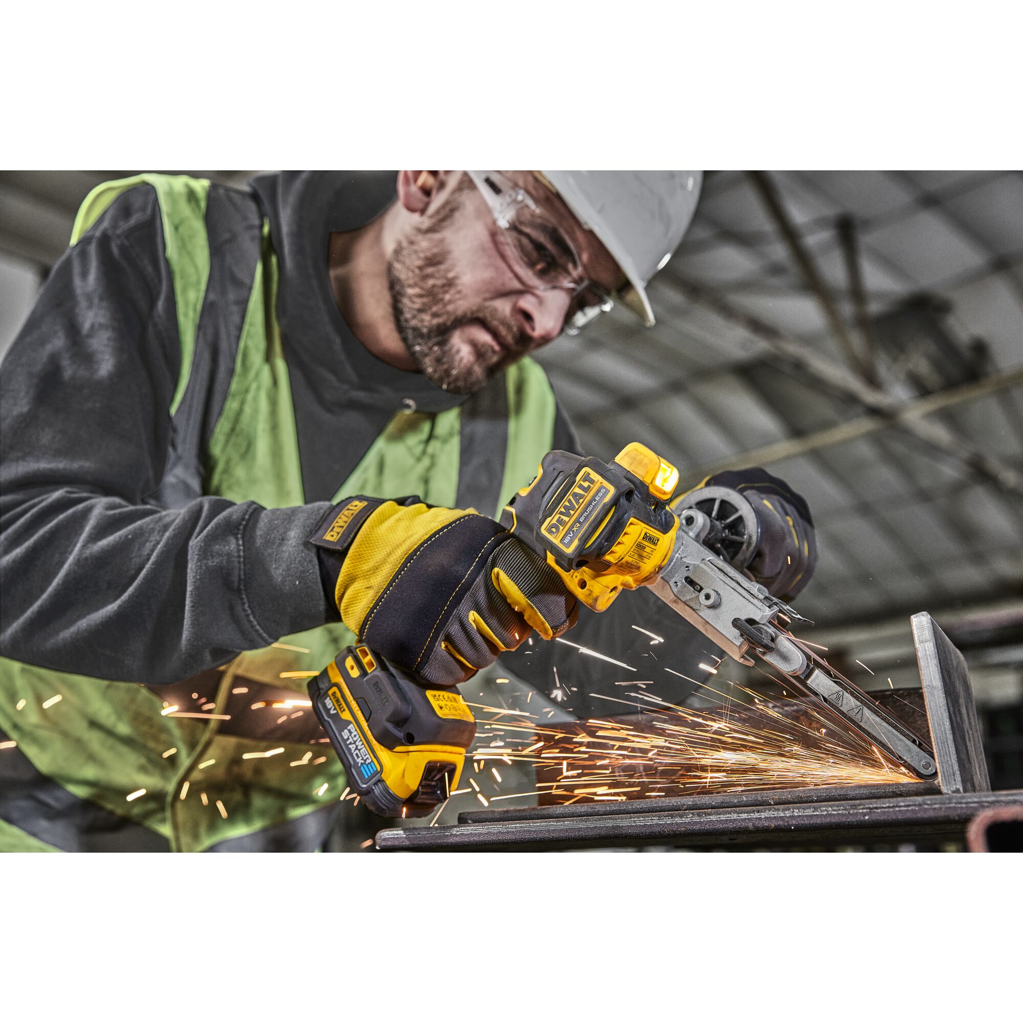 Worker using 18V XR Band File to sand metal
