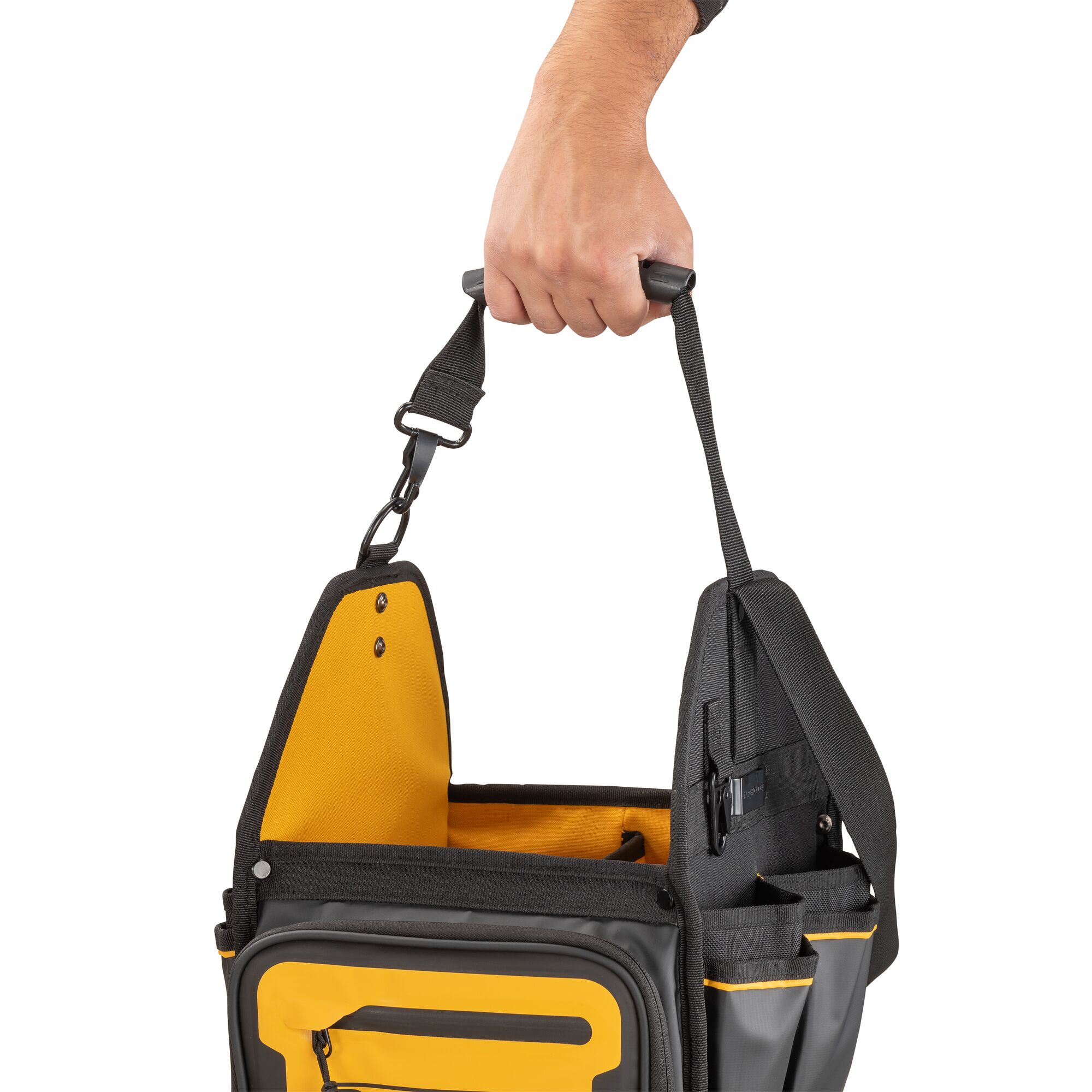 Dewalt 11" Pro Electrician Tote being carried using one of the straps"